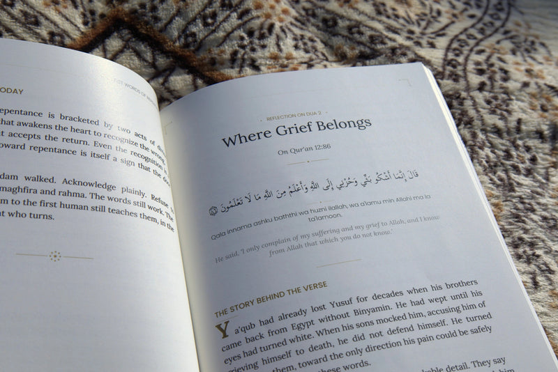 Dhikr open to Where Grief Belongs on a patterned rug
